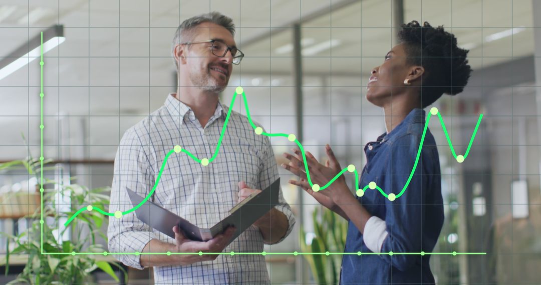 Diverse Colleagues Analyzing Graph in Modern Office
