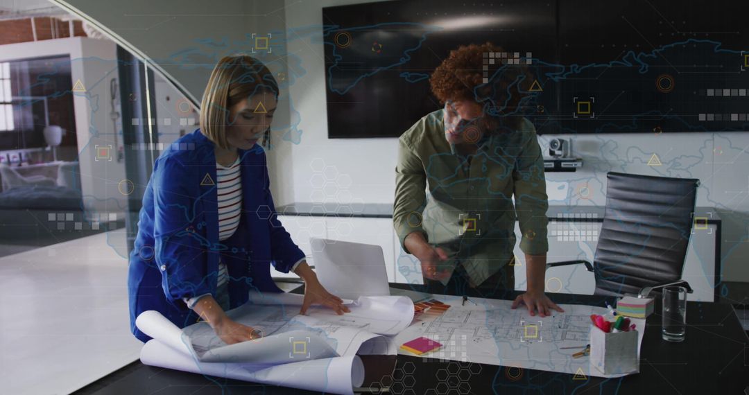 Architects Collaborating Over Blueprints in Modern Office Space