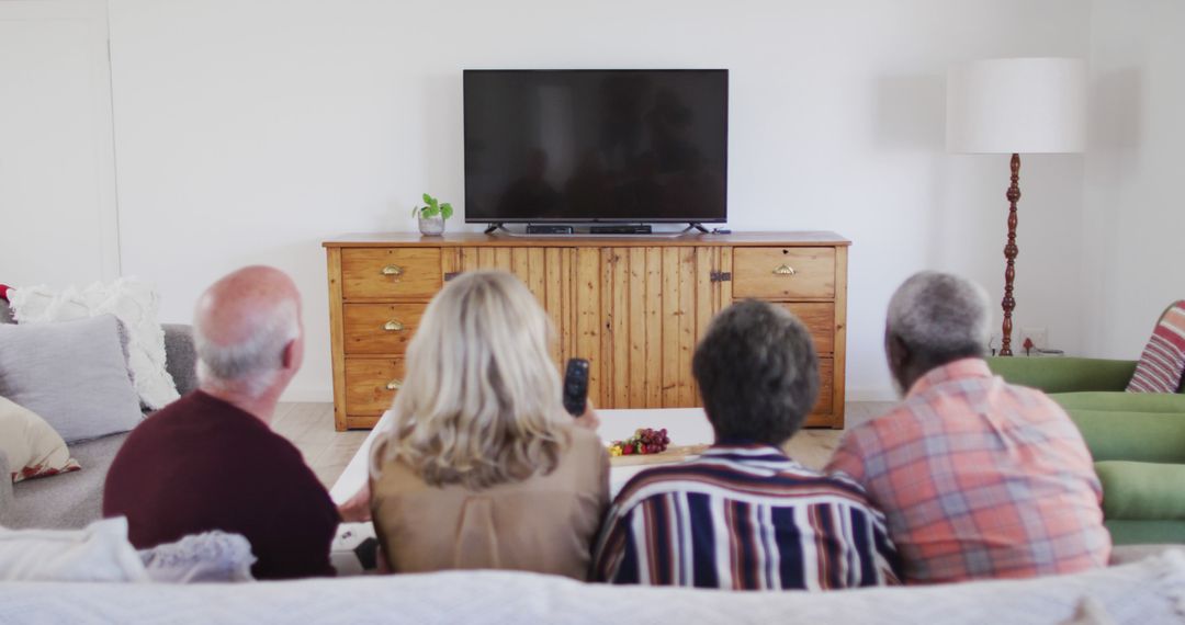 Seniors Watching Television Together in Living Room - Free Images, Stock Photos and Pictures on Pikwizard.com