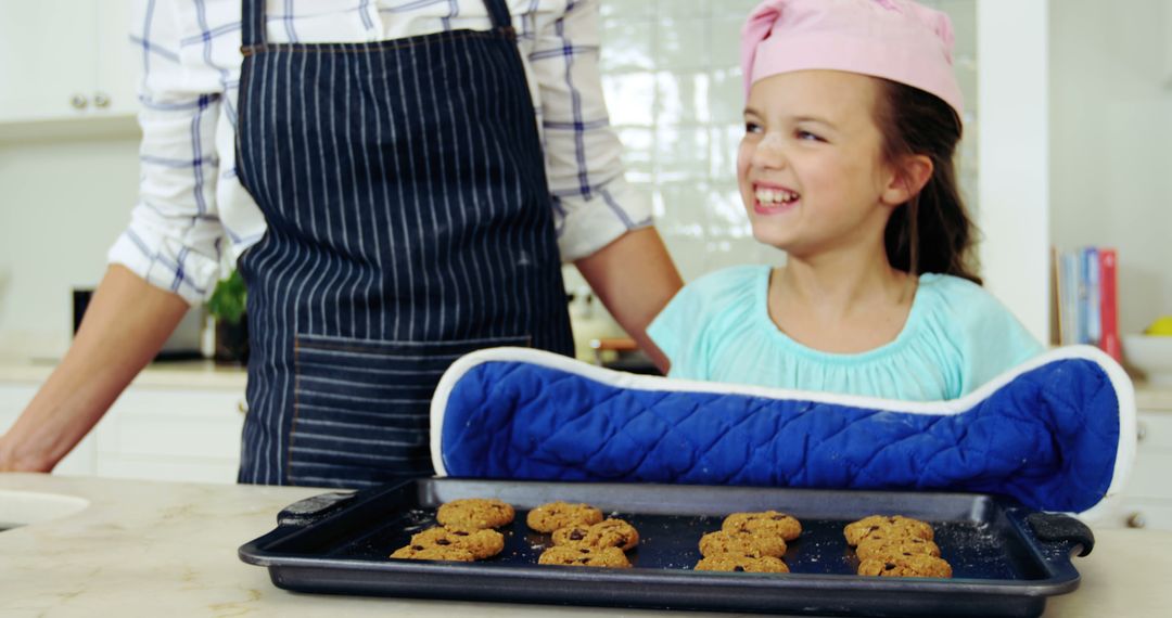 Child and Parent Baking Cookies in Modern Kitchen - Free Images, Stock Photos and Pictures on Pikwizard.com