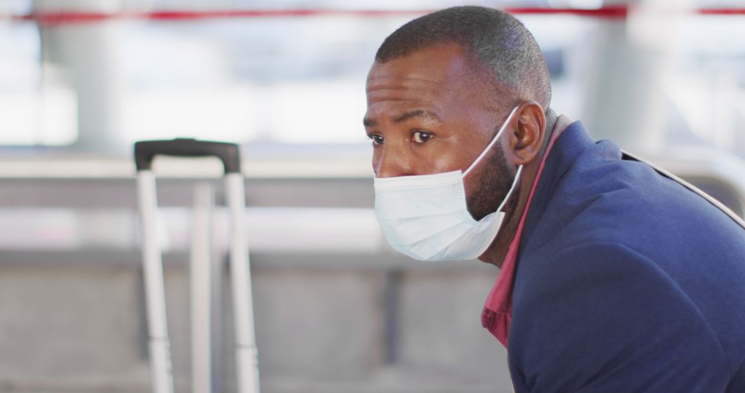 Man with Face Mask Waiting for Public Transport During Pandemic