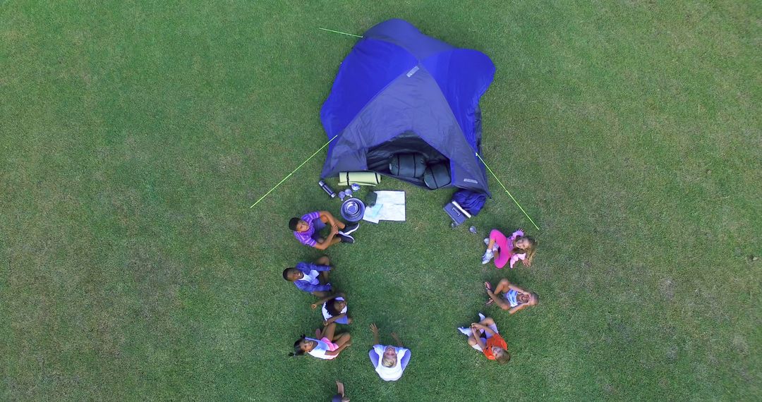 Aerial View of Family Camping with Tent on Grass - Free Images, Stock Photos and Pictures on Pikwizard.com