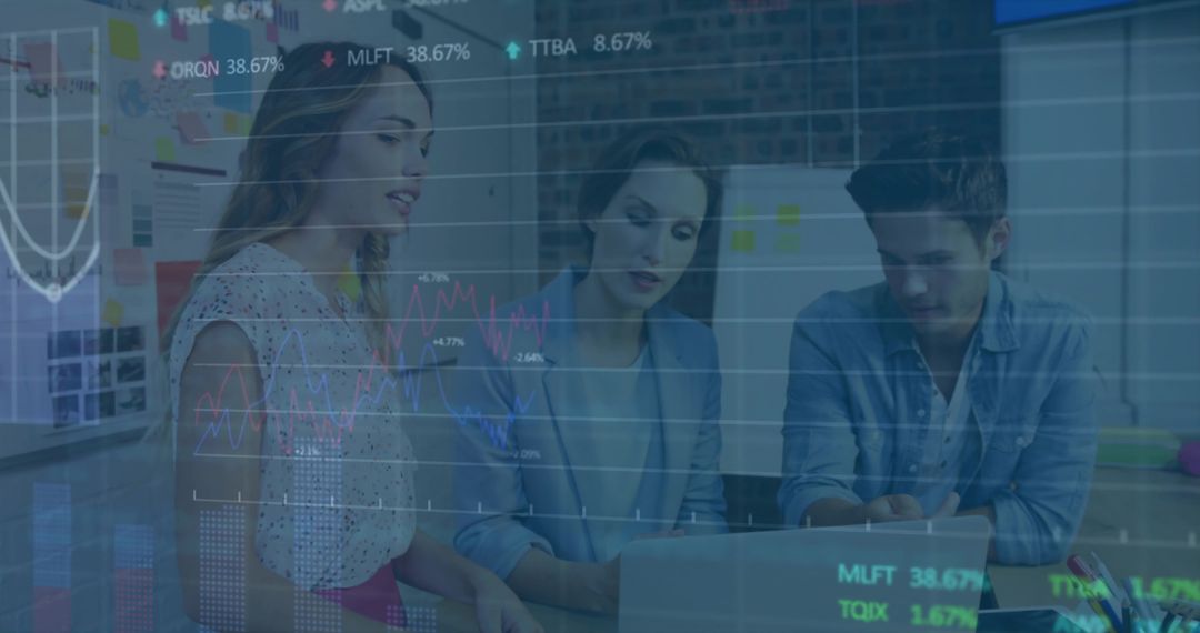 Team reviewing laptop data and charts in modern workspace collaborating on strategy