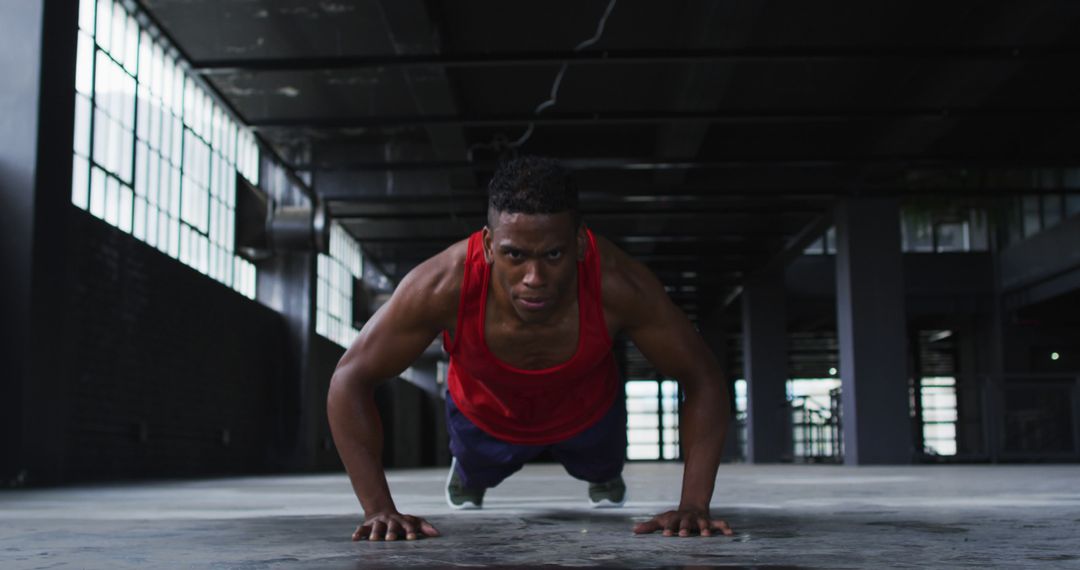 Determined Athlete Doing Push-Ups in Urban Setting