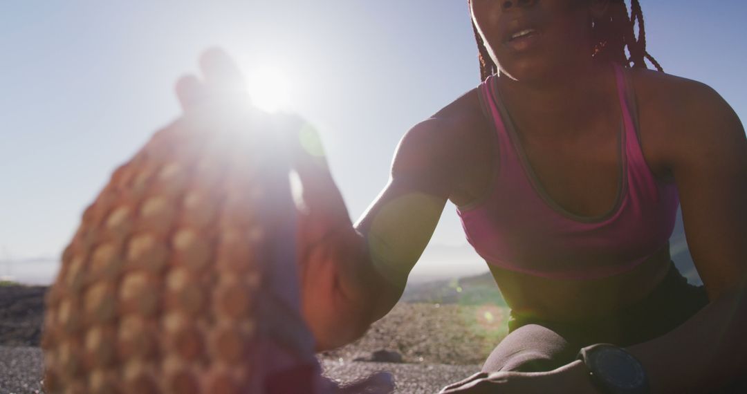 Female Athlete Stretching Outdoors in Morning Sunlight - Free Images, Stock Photos and Pictures on Pikwizard.com