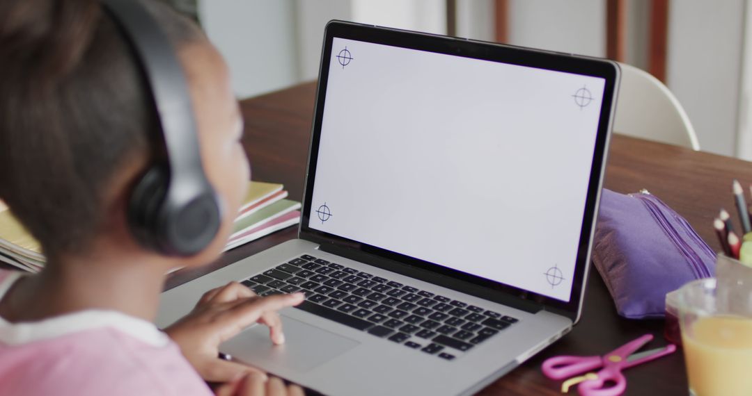 African American Girl Learning Online with Laptop