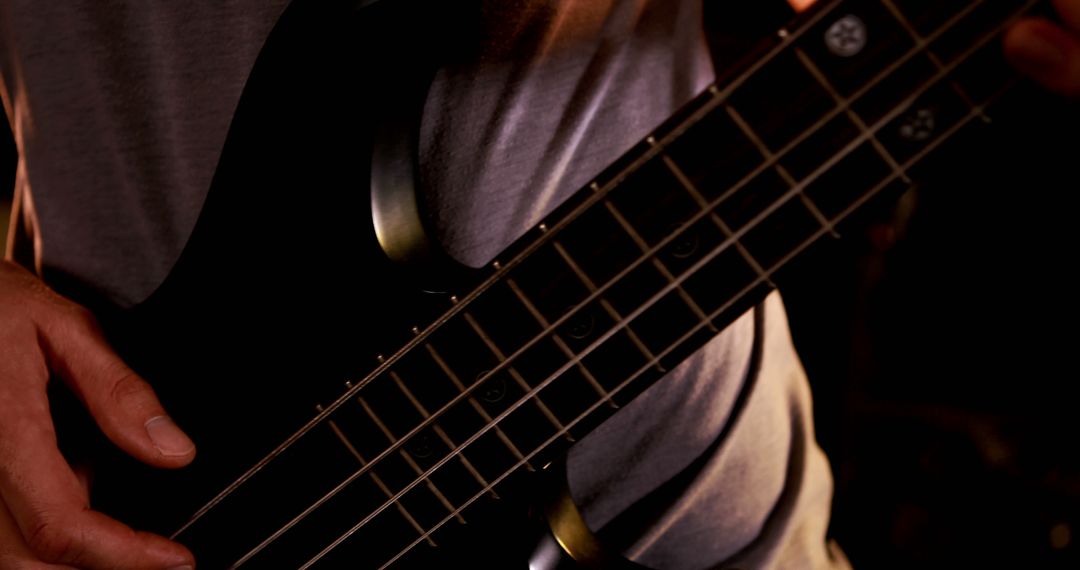 Close-Up of Musician Playing Electric Bass Guitar - Free Images, Stock Photos and Pictures on Pikwizard.com