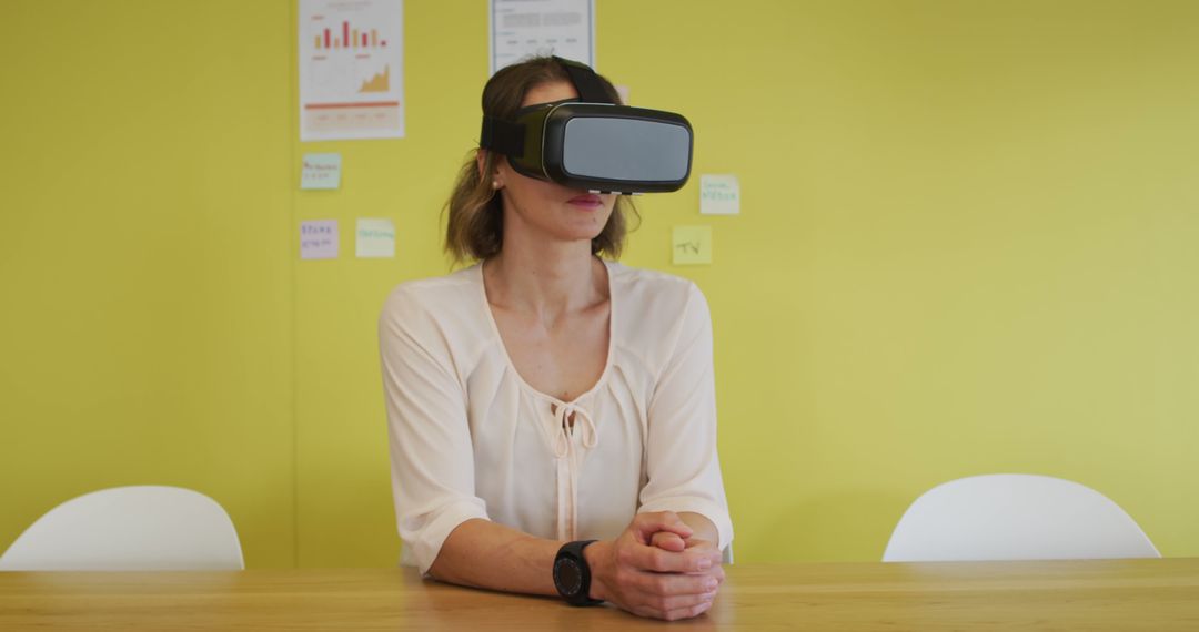 Woman Testing Virtual Reality Headset in Modern Office Setting - Free Images, Stock Photos and Pictures on Pikwizard.com