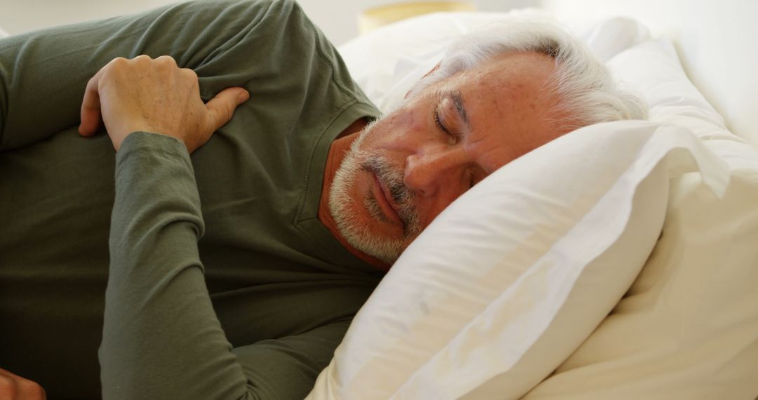 Senior Man Sleeping Peacefully on Comfortable Bed - Free Images, Stock Photos and Pictures on Pikwizard.com