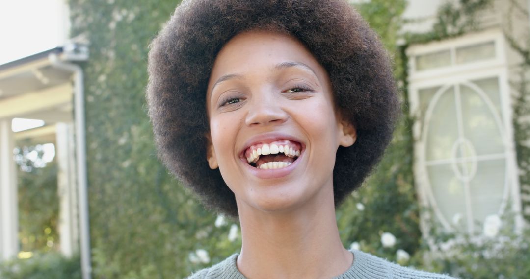 Smiling Woman Enjoying a Sunny Day at Home