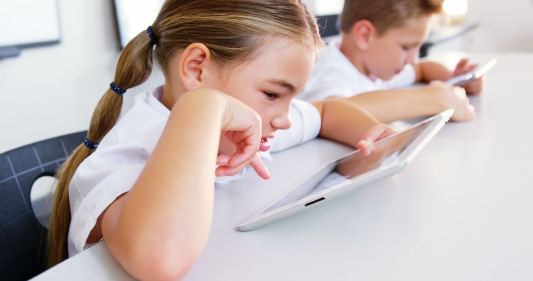 Children Intently Working on Tablets in Classroom - Free Images, Stock Photos and Pictures on Pikwizard.com