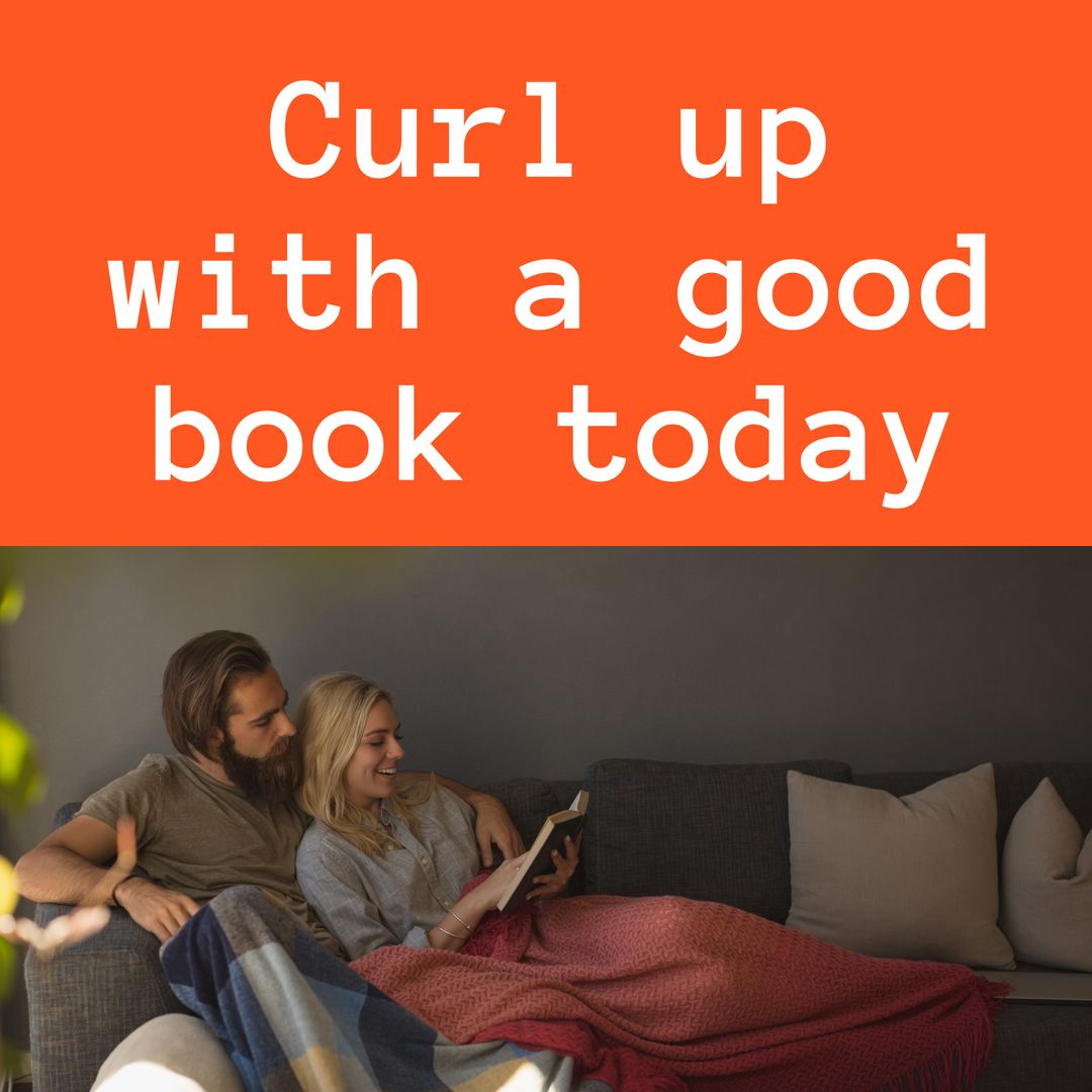 Couple Relaxing on Couch Reading Book Together
