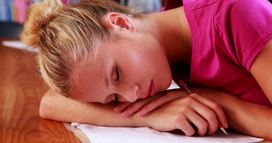 Tired Student Sleeping on Desk During Study Session - Free Images, Stock Photos and Pictures on Pikwizard.com