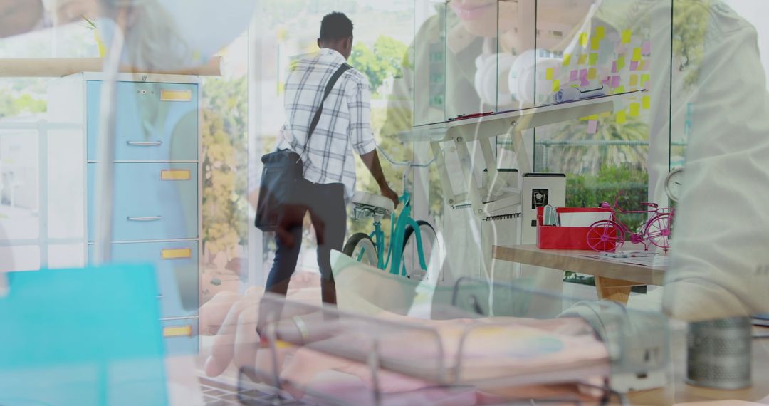 Creative Office Work with Colleagues Using Laptops and Bike Commute