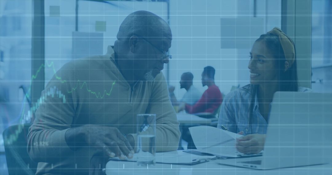 Diverse Business Professionals Analyzing Financial Data on Computer