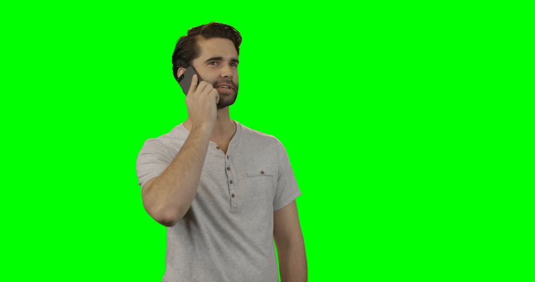 Man Talking on Phone in Front of Green Screen - Free Images, Stock Photos and Pictures on Pikwizard.com