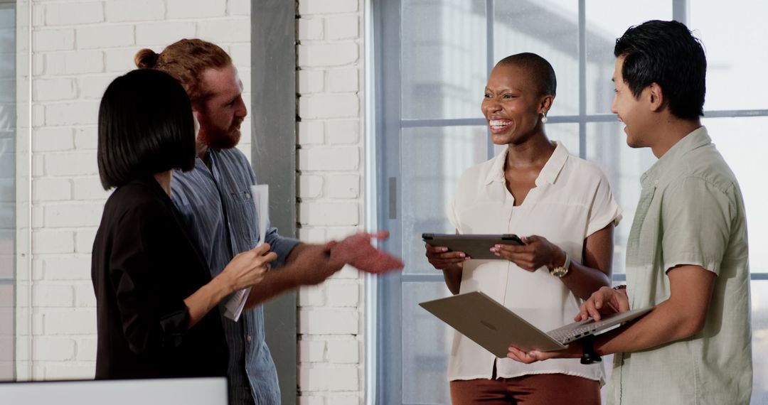 Diverse Team Engaging in Modern Office Collaboration
