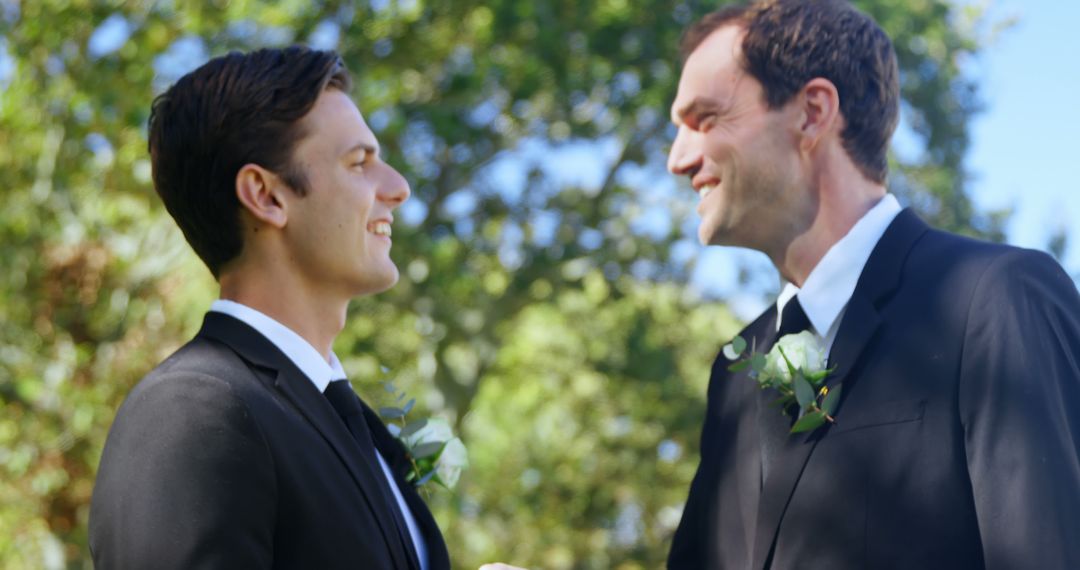 Happy Groomsmen Shaking Hands in Outdoor Ceremony - Free Images, Stock Photos and Pictures on Pikwizard.com