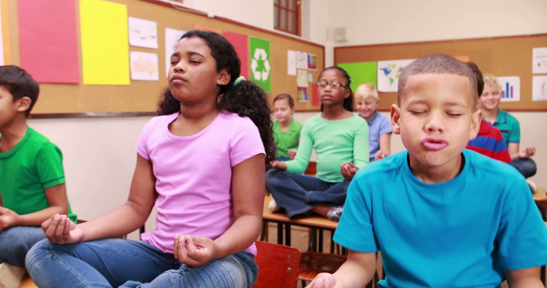 Diverse Elementary School Children Practicing Mindfulness Meditation in Classroom - Free Images, Stock Photos and Pictures on Pikwizard.com