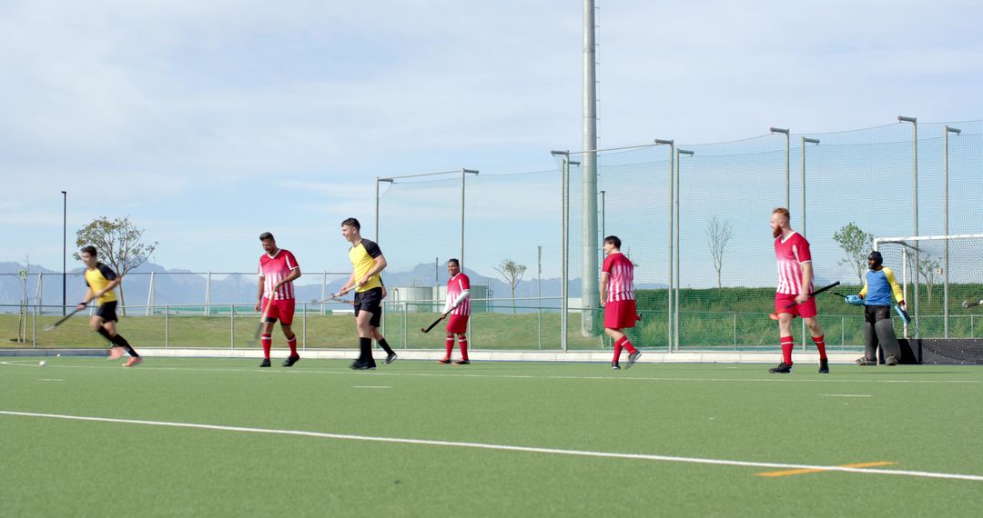 Field Hockey Players Lining Up for Outdoor Practice on Turf Field