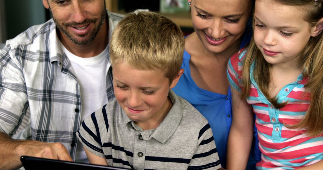 Family using digital tablet together at home - Free Images, Stock Photos and Pictures on Pikwizard.com