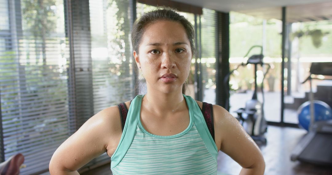 Determined Woman Working Out in Modern Gym - Free Images, Stock Photos and Pictures on Pikwizard.com