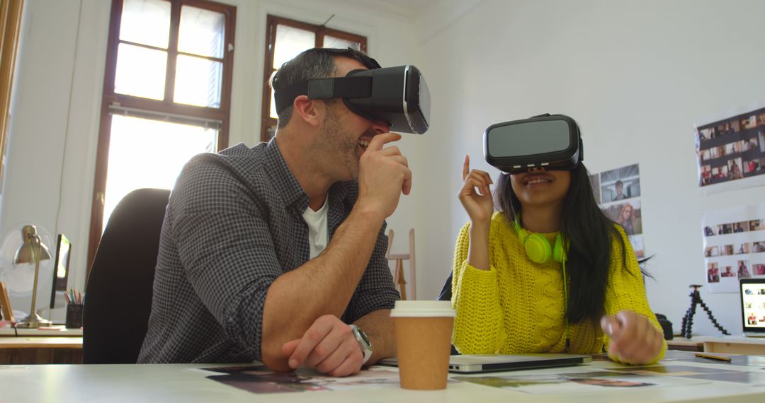 Man and Woman Enjoying Virtual Reality Experience in Modern Office - Free Images, Stock Photos and Pictures on Pikwizard.com