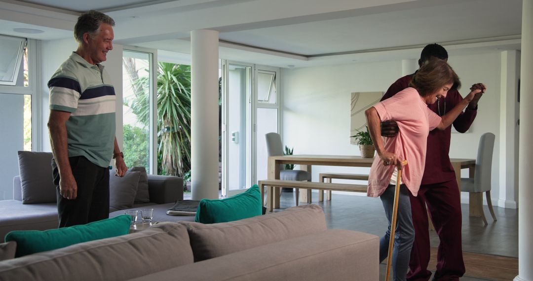 Senior Woman Walking with Cane and Assistance, Home Support Atmosphere