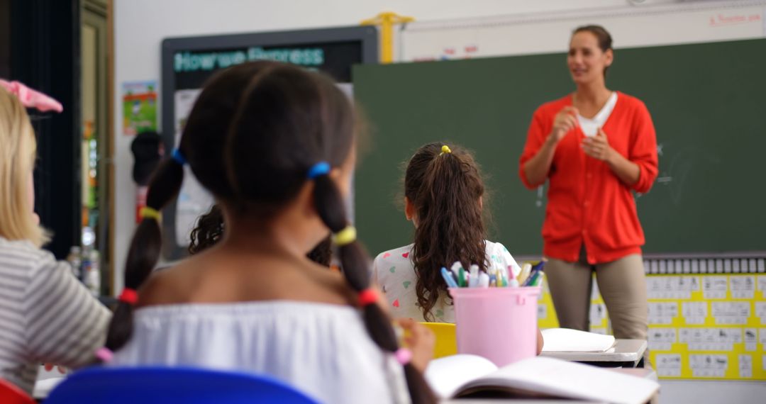 Engaged Elementary Students in Classroom Listening to Teacher