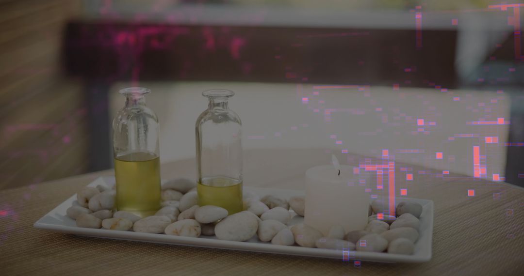 Serene Spa Setup with Aromatic Oil and Candle on Pebble Tray