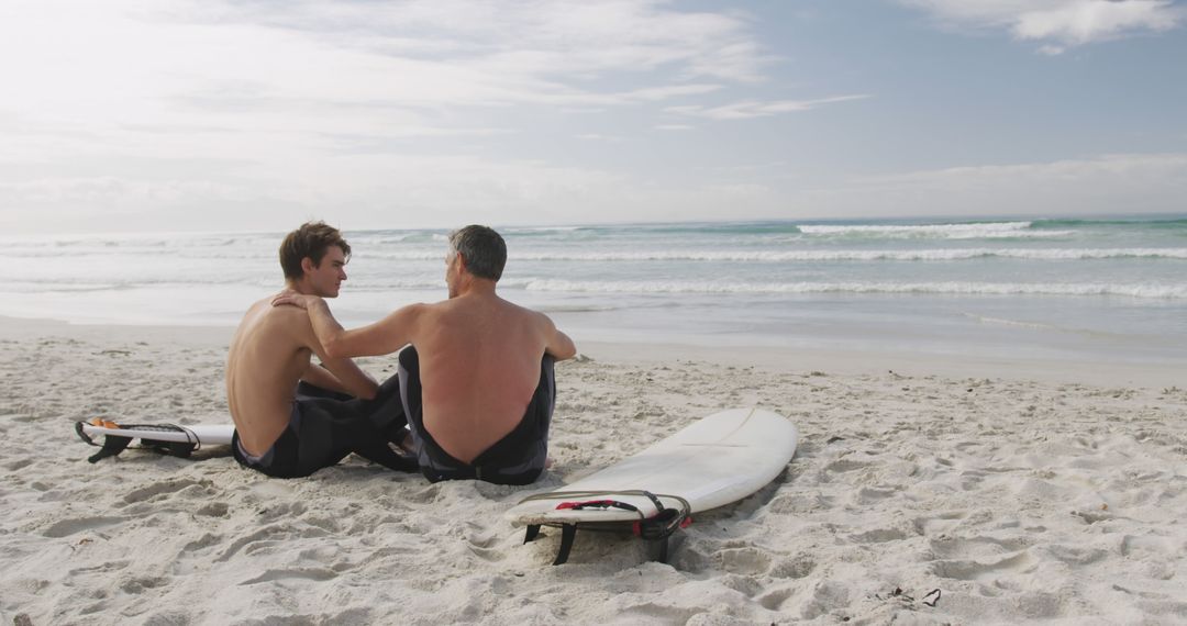 Father and Son Bonding on Beach with Surfboards - Free Images, Stock Photos and Pictures on Pikwizard.com