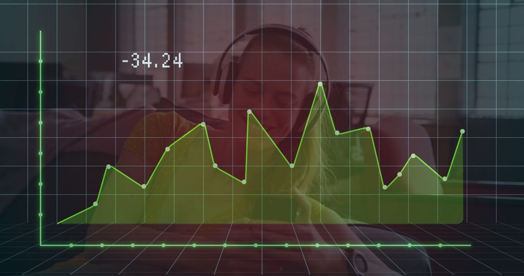 Woman Working on Laptop with Financial Data Graph Overlay