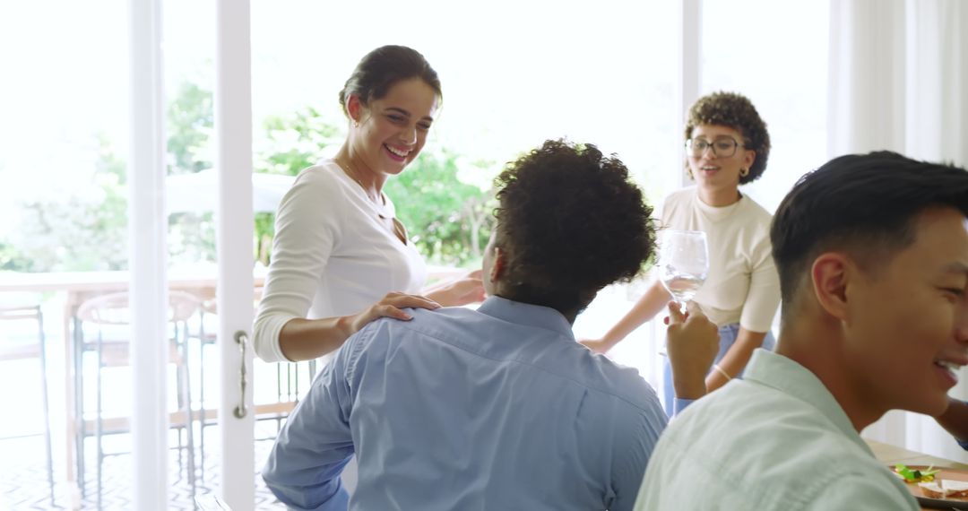 Friends Celebrating Event with Socializing and Drinks at Home