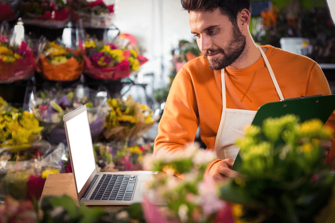 Transparent Laptop Screen in Vibrant Flower Shop