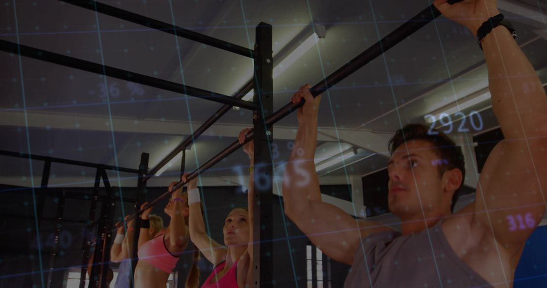 Athletes Performing Pull-Ups in Gym with Data Projections