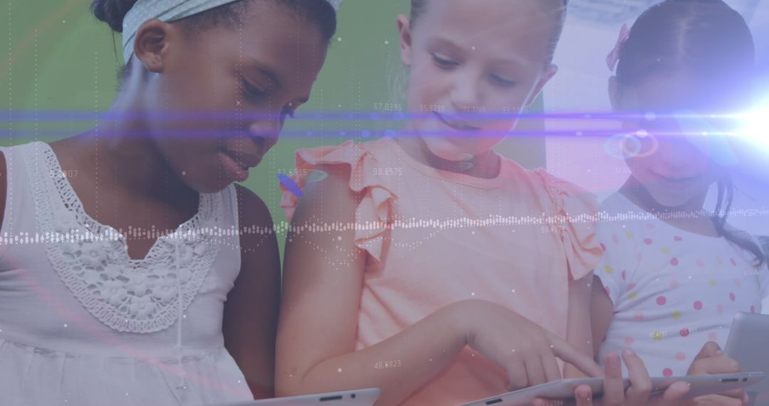 Young Schoolchildren Engaging with Digital Learning Tablets