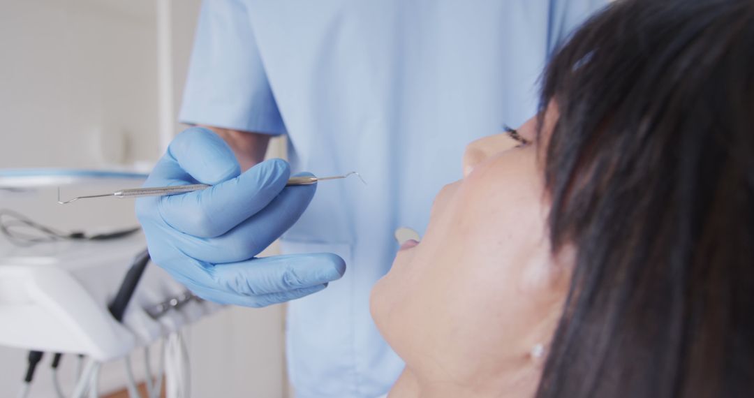 Dentist examining patient in clinic - Free Images, Stock Photos and Pictures on Pikwizard.com