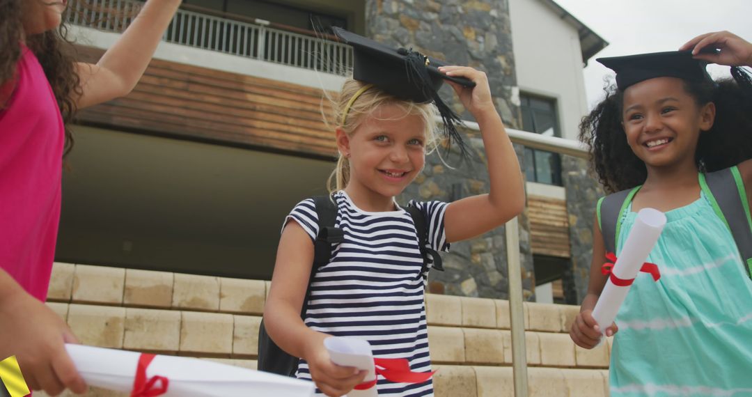 Children Celebrating Graduation Outdoors Holding Diplomas and Caps - Free Images, Stock Photos and Pictures on Pikwizard.com