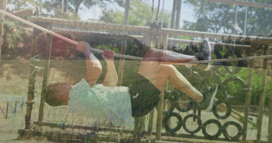 Man Navigating Rugged Outdoor Obstacle Course with Ropes and Tires