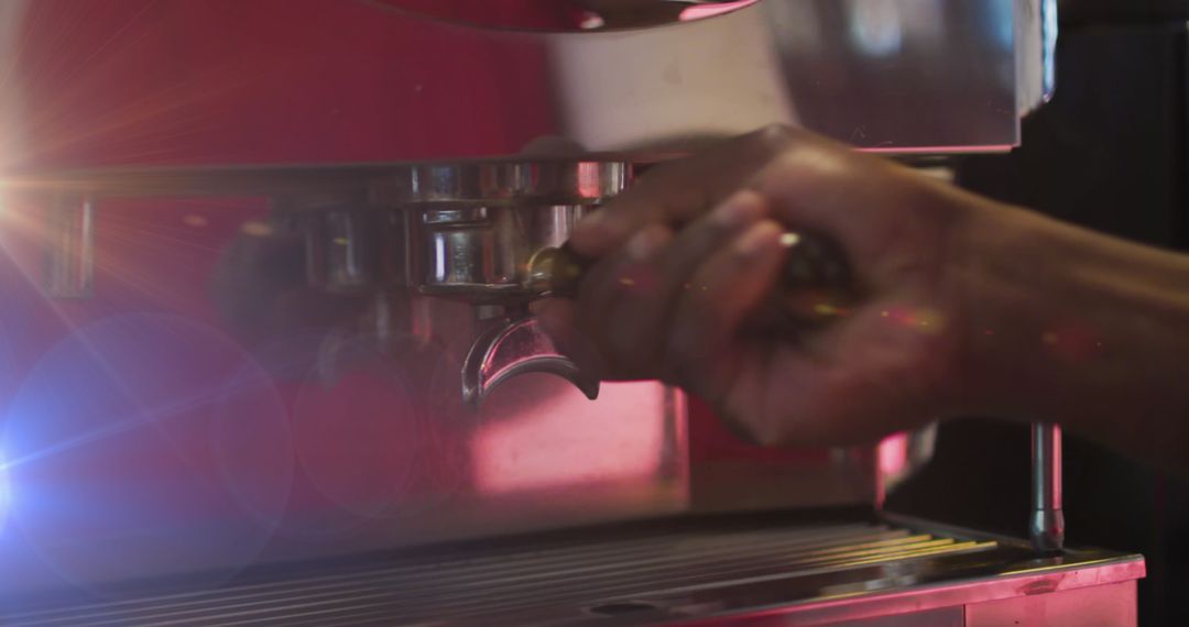 Barista Hand Operating Espresso Machine at Coffee Shop