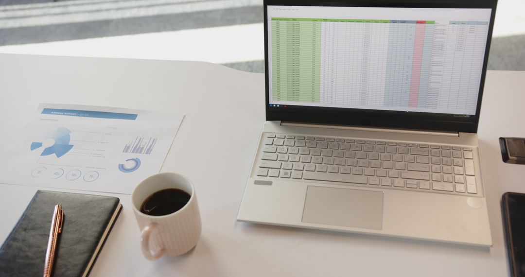 Color-coded Spreadsheet on Laptop in Minimalist Workspace
