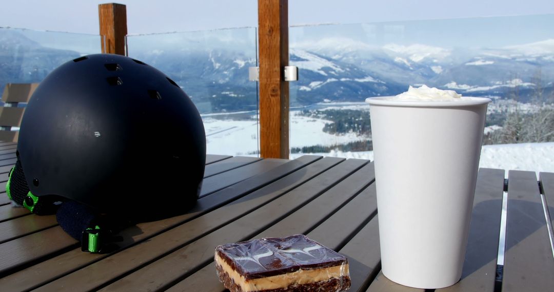 Hot Beverage on Winter Balcony Overlooking Snowy Mountains - Free Images, Stock Photos and Pictures on Pikwizard.com