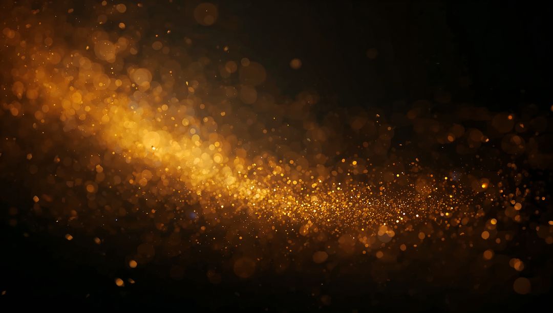 Golden Glitter Stream Flowing Across Dark Backdrop with Bokeh Sparkle Trail