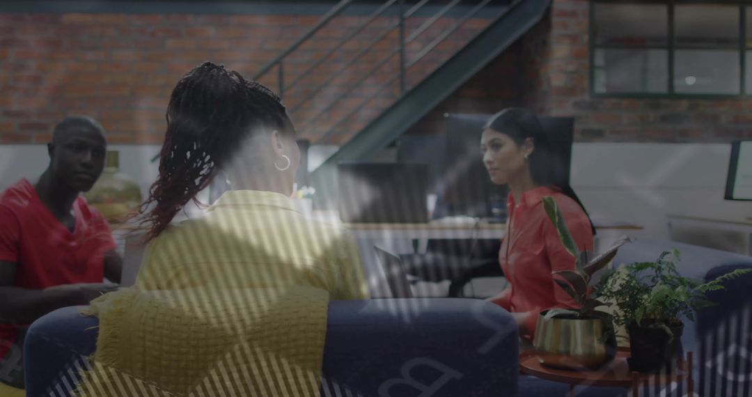 Colleagues Collaborating in Modern Industrial Loft Lounge with Glass Reflection