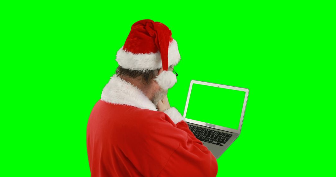 Santa Claus Using Laptop with Green Screen - Free Images, Stock Photos and Pictures on Pikwizard.com