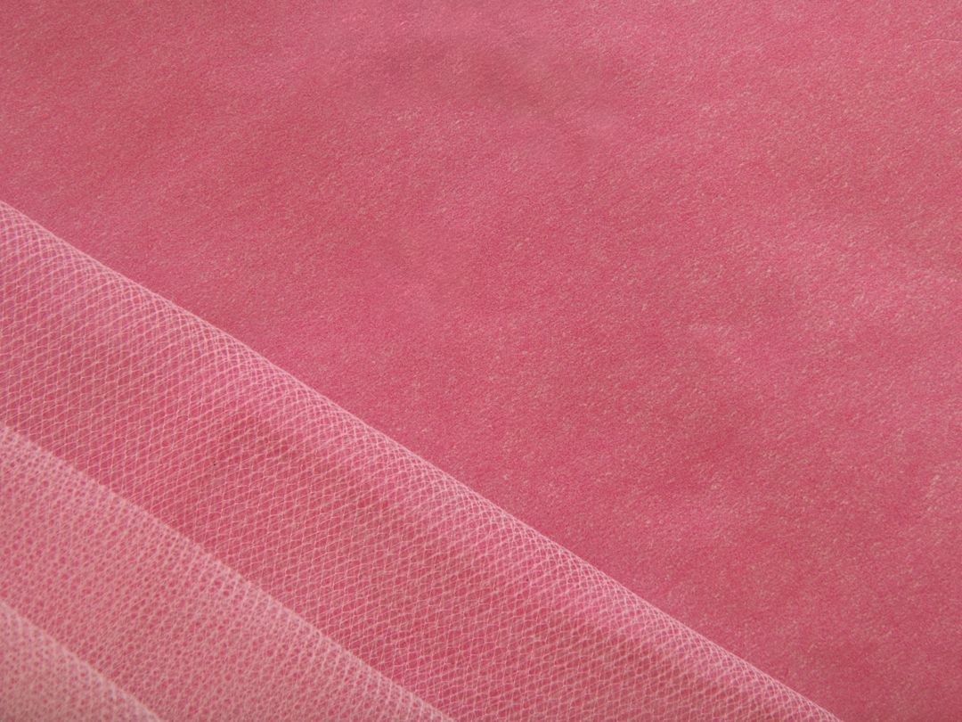 Close-up of Textured Pink Fabric Background