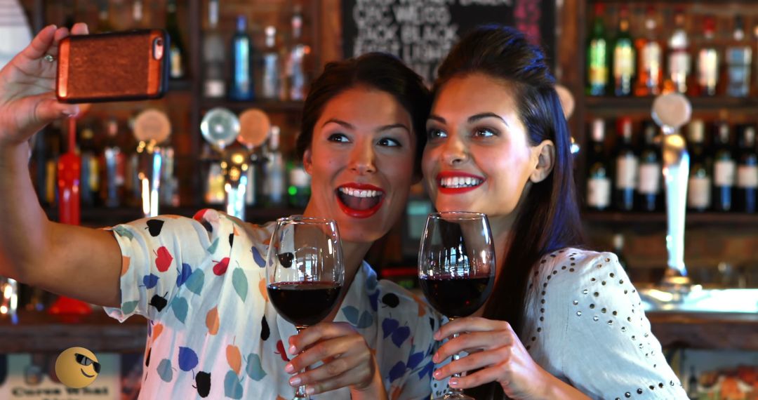 Two Women Taking Selfie at Bar with Drinks