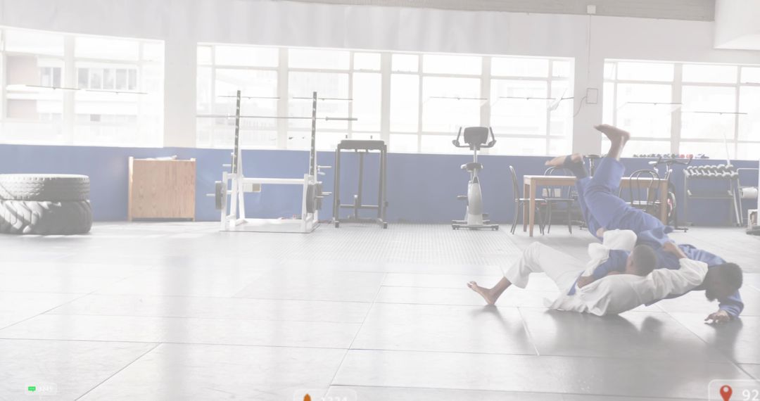BJJ partners grappling on mats in bright dojo with fitness gear and generous copy space