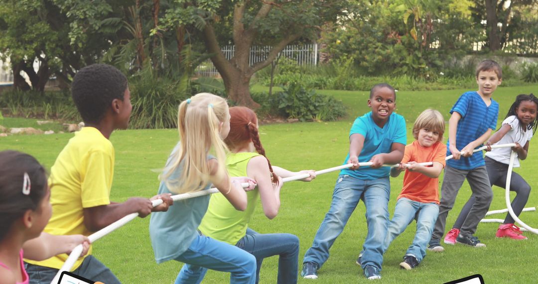 Kids Playing Tug of War in Park on Bright Sunny Day