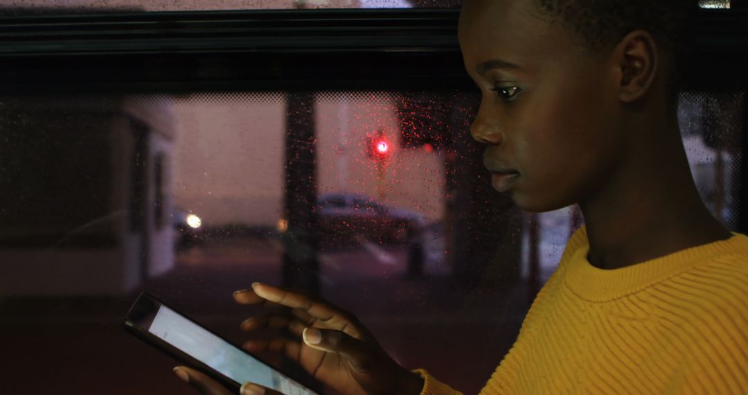 Young Woman Using Smartphone While Traveling at Night - Free Images, Stock Photos and Pictures on Pikwizard.com